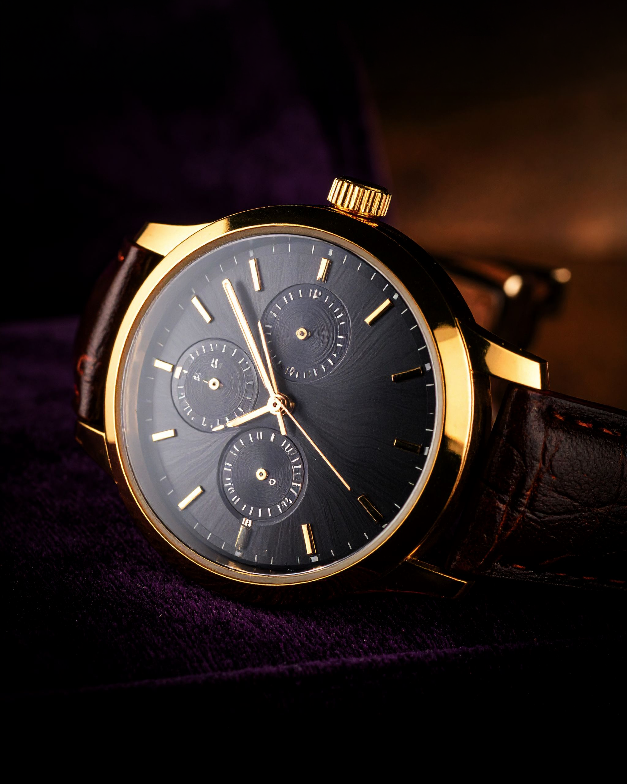 Gold chronograph with dark guilloché dial